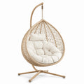 Chaise suspendue en rotin beige avec coussin en coton