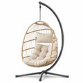 Fauteuil suspendu en rotin avec structure en métal et coussins beiges