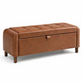 Banc de rangement en cuir synthétique avec pieds en bois marron